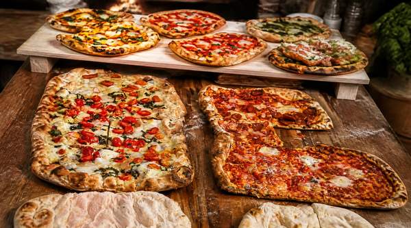 Pinsa at Pala Bakery Moves Beyond Tomato Sauce With Besciamella and Pesto Genovese